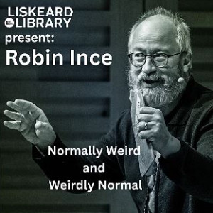 A black and white photograph of Robin Ince. Robin is a middle(ish) aged gentleman with white hair and a white beard. 