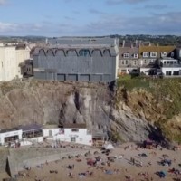 A photograph of lots of buildings on a cliff edge.
