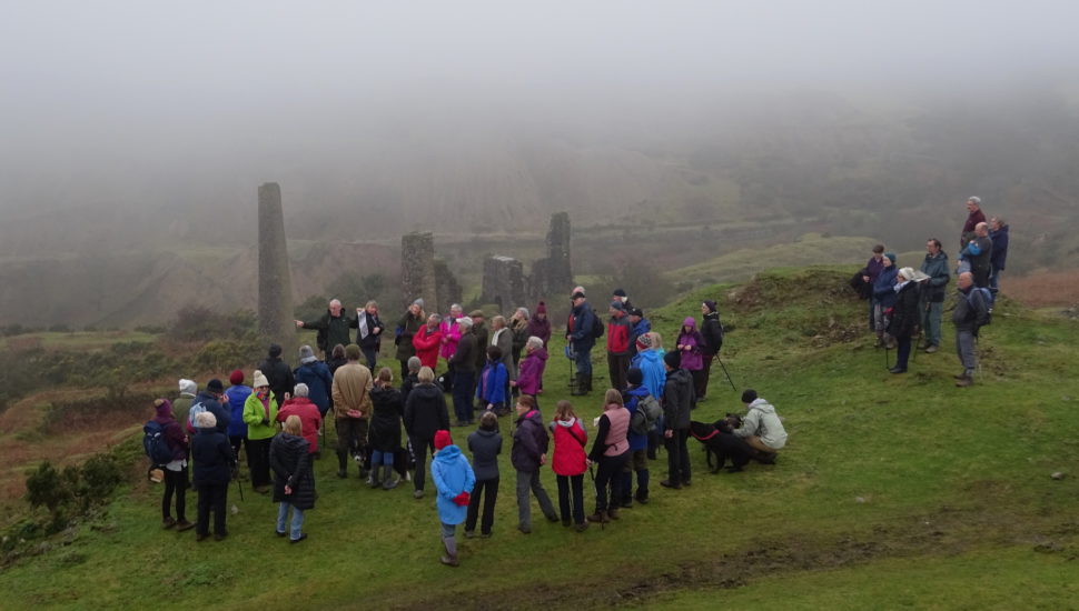 Above South Caradon mine, Brian addresses the walkers